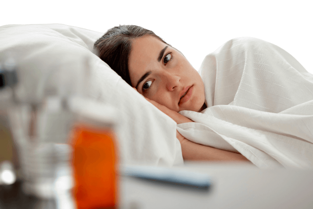 sick woman lying down on bed